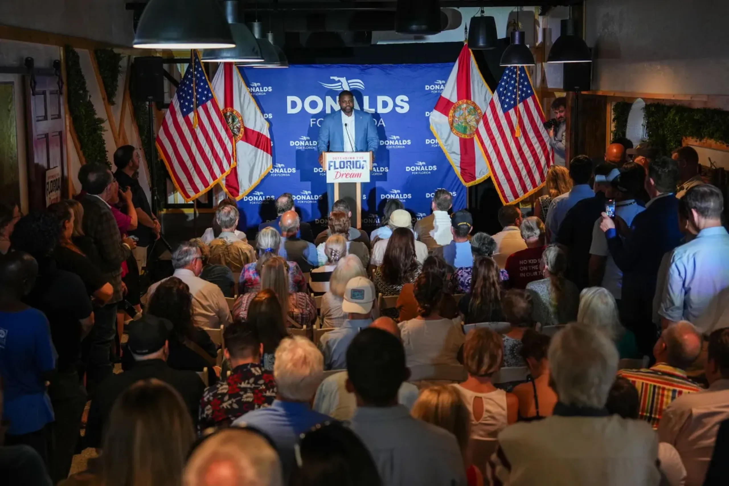 Byron Donalds speaking to a packed room at a Defending the Florida Dream event